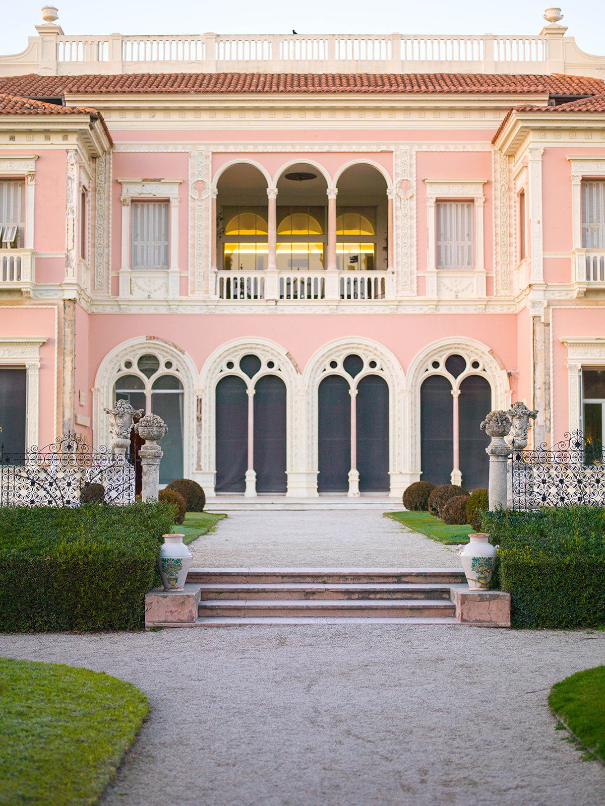 Pink façade, Venetian arches and white stone details at Villa Ephrussi de Rothschild
